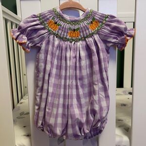 Purple and white plaid baby girls bubble onesie with pumpkin collar.